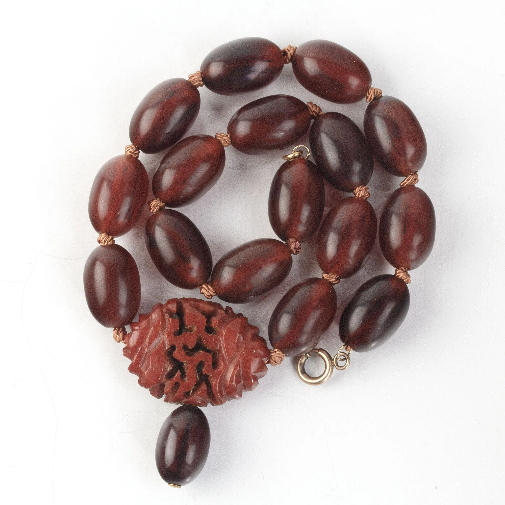 Vintage Bakelite Amber oval bead necklace with carved Bakelite focal bead.  nlbk804