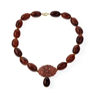 Vintage Bakelite Amber oval bead necklace with carved Bakelite focal bead.  nlbk804